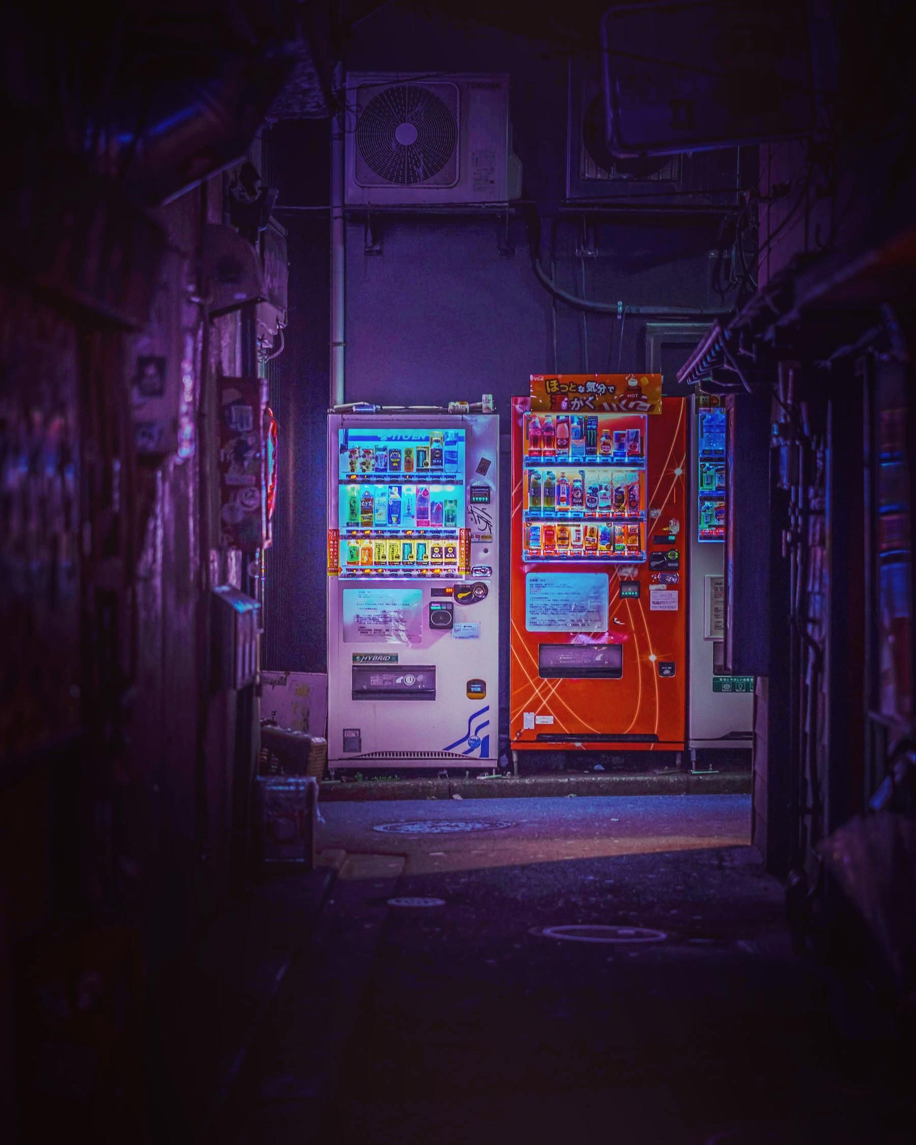 Japanese vending machines in a dark alleyway