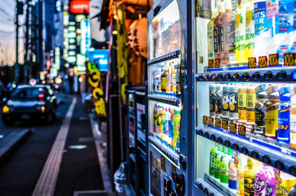 Japanese vending machines on the side of a road